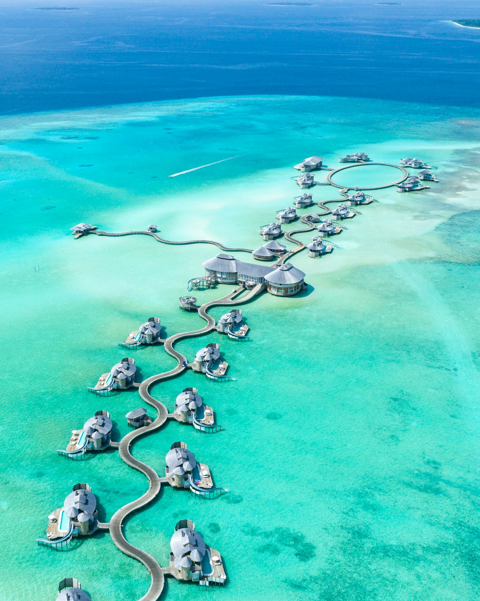 Overwater villas on a still lagoon