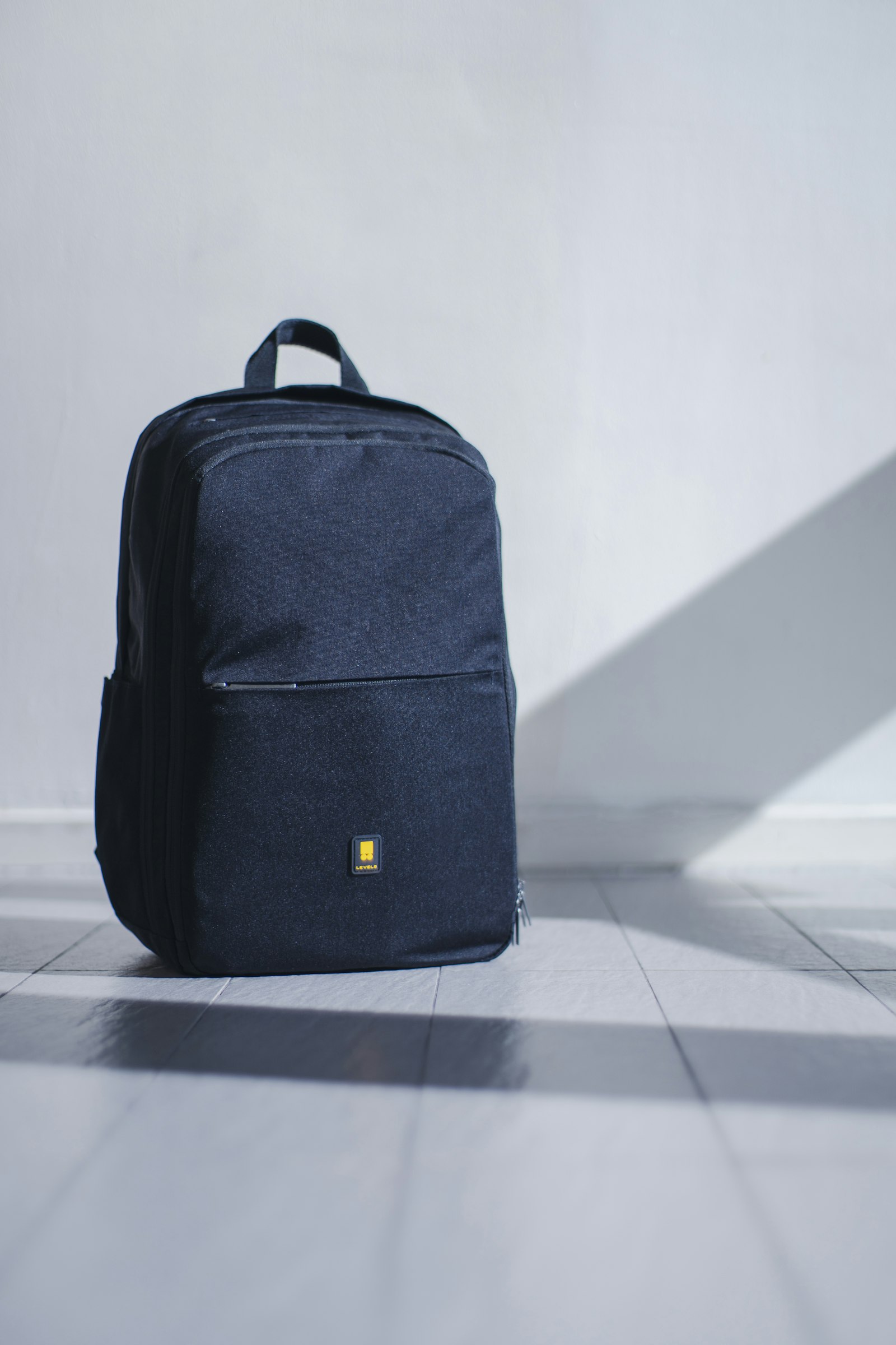 Leather travel bag and essentials by a window